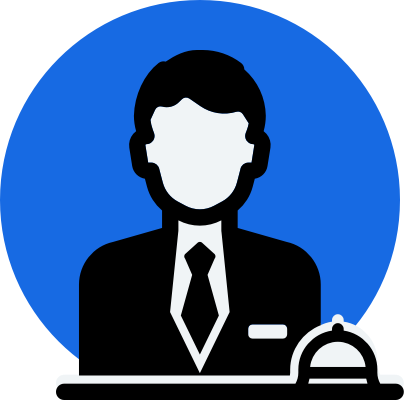 Concierge in suit behind desk with service bell